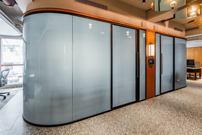 Summit partitions system with curved glass specified by the client for a contemporary look.