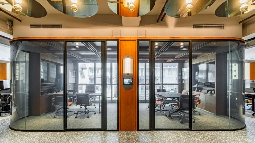 JEB Group unveils partitions optimized for acoustics, featuring a wood-lined meeting room in Hong Kong.